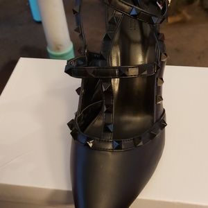Black strappy heels with black studs